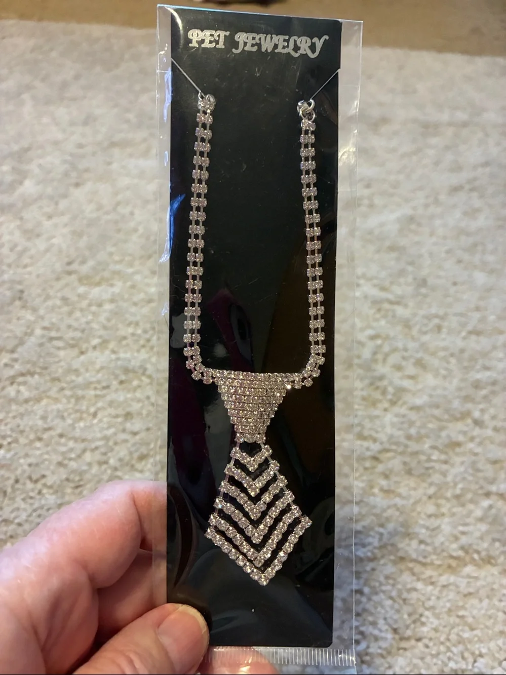 Dog Necklace is full of rhinestones. This necklace is a neck tie NWT
